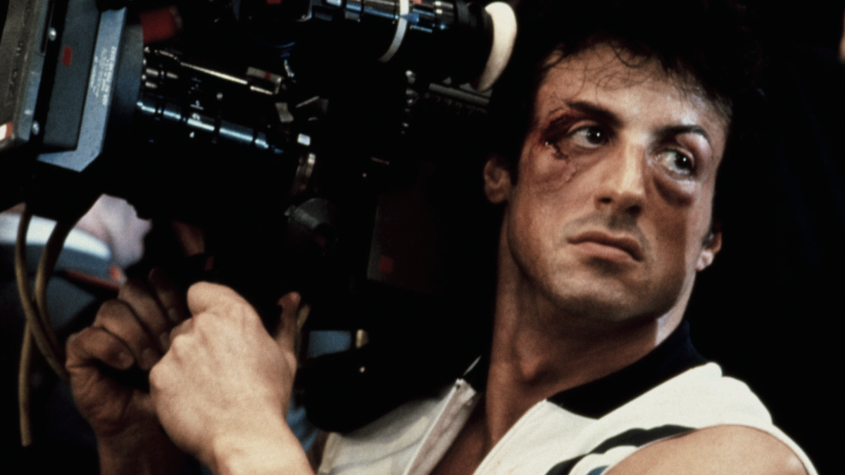 Sylvester Stallone holding a camera