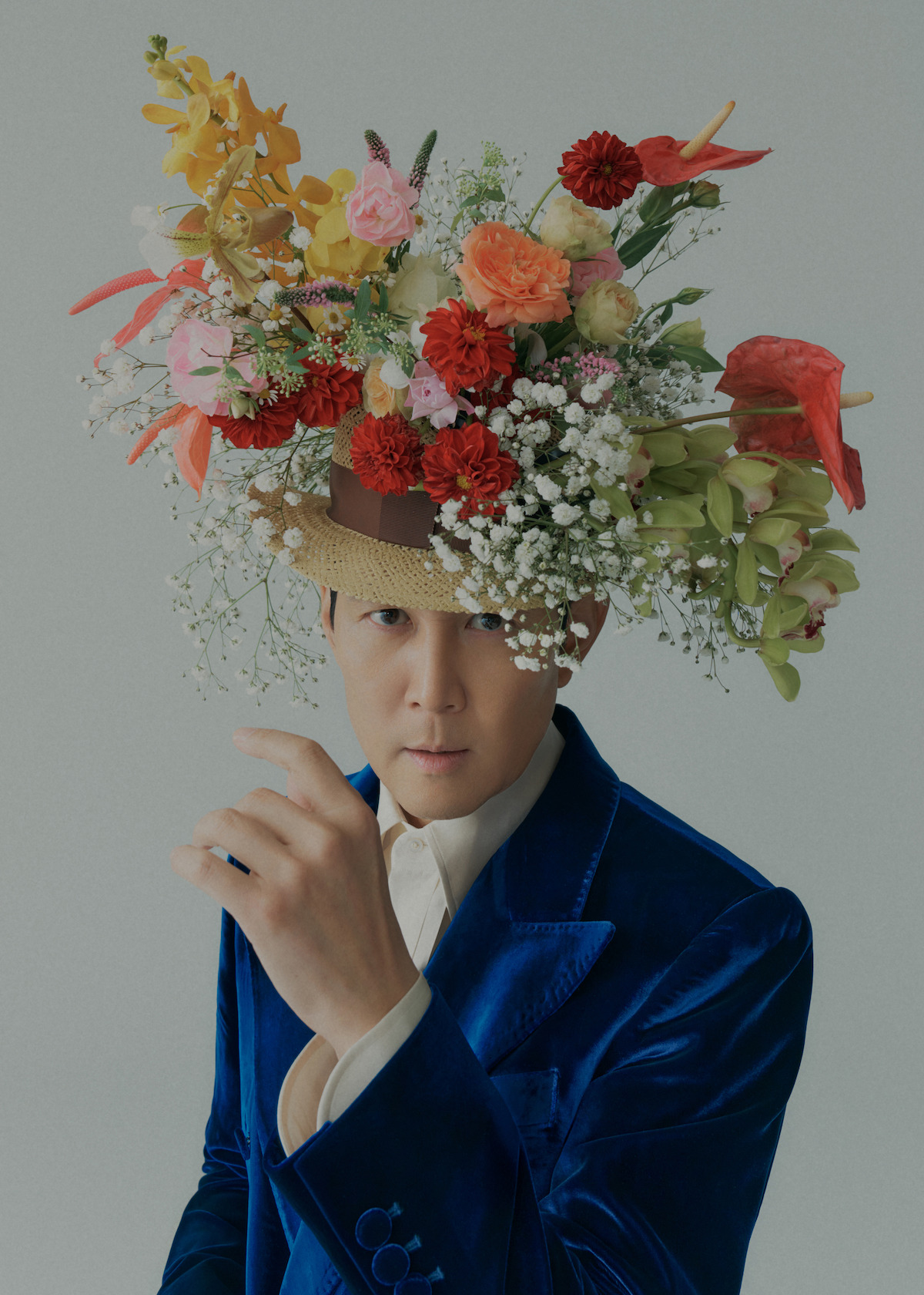 Lee Jung-jae of ‘Squid Game’ wearing a hat filled with fresh flowers