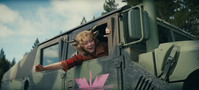 Christian Convery as Gus leans out of the window of a painted tank in Season 3 of 'Sweet Tooth'