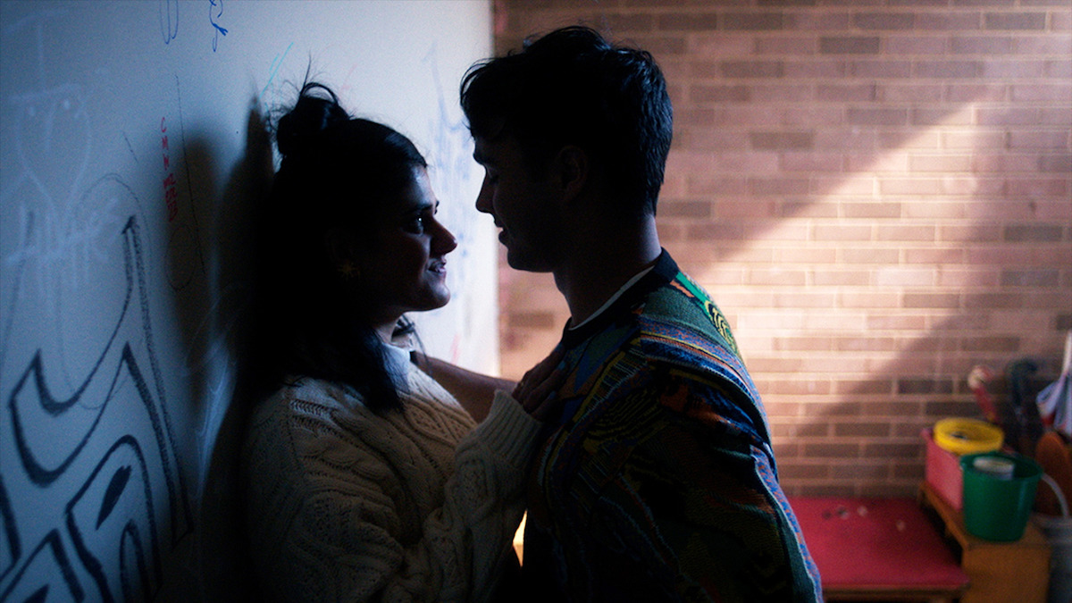 Two teens face each other in a high school hallway in Season 2 of 'Heartbreak High'
