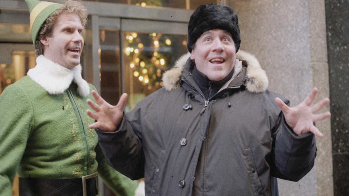 A moment from the filming of Elf, with Will Ferrell in costume
