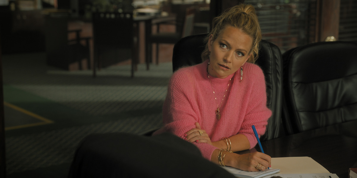 Becki Newton as Lorna Crane in ‘The Lincoln Lawyer’ Season 2, wearing a pink sweater.