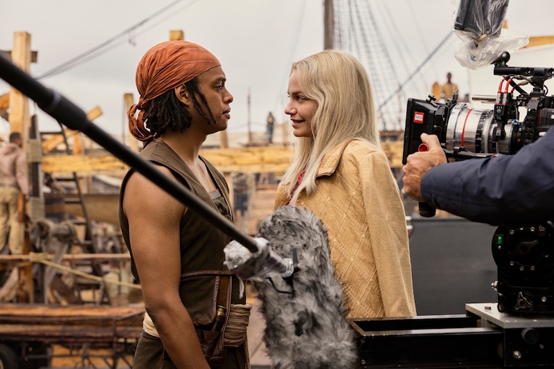 Jacob Romero as Usopp and Celeste Loots as Kaya filming a scene together on the set of Season 1 of 'One Piece.'