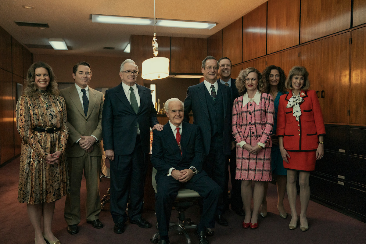 Lesley Faulkner as Elizabeth Sackler, Matthew Broderick as Richard Sackler, Sam Anderson as Raymond Sackler, Clark Gregg as Arthur Sackler Sr., John Rothman as Mortimer Sackler, Dan Fox as Arthur Sackler Jr., Catherine Tait as Jillian Sackler, Maria Ricossa as Else Sackler, Michele Kaye as Denise Sackler pose together in an office in ‘Painkiller.’
