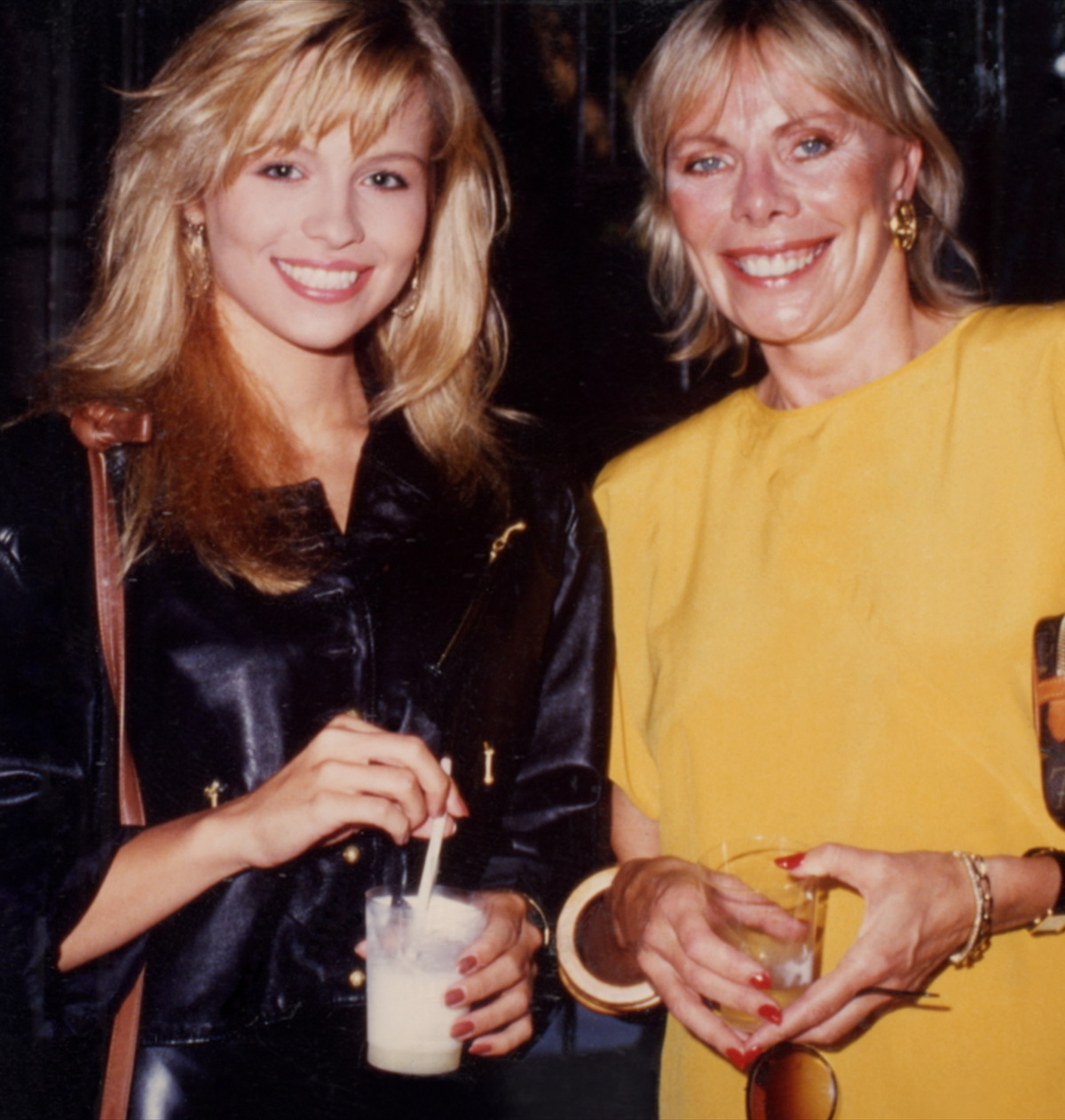 A young Pamela Anderson smiles alongside Playboy's photo editor at the time, Marilyn Grabowski.