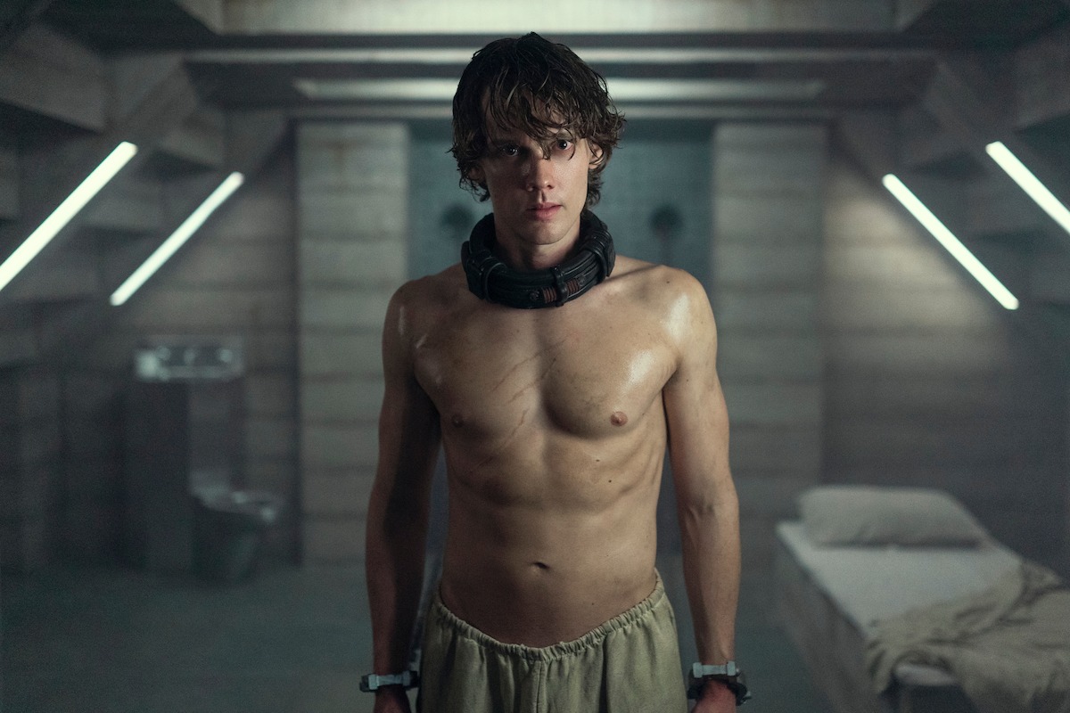 Hunter Doohan as Tyler Galpin stands in a cell in Season 2 of ‘Wednesday’