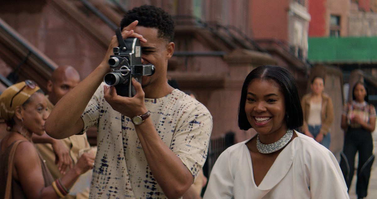 Keith Powers holds a video camera next to Gabrielle Union in a still from 'The Perfect Find.'