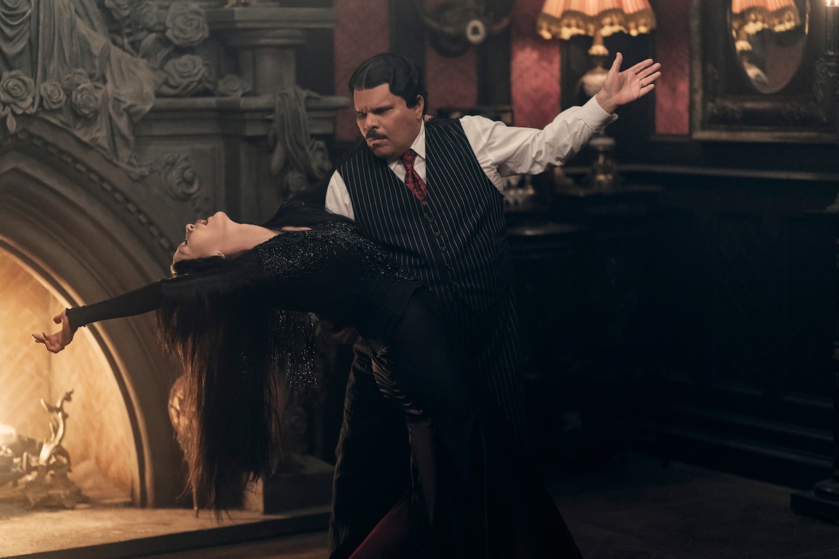 Catherine Zeta-Jones as Morticia Addams and Luis Guzmán as Gomez Addams tango together in Season 2 of ‘Wednesday’