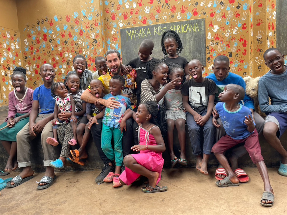 David Vieira Lopez witha group of the Masaka Kids Africana children.