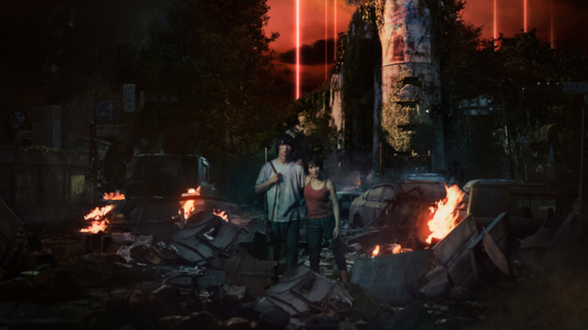 Two people wandering through a post-apocalyptic landscape.