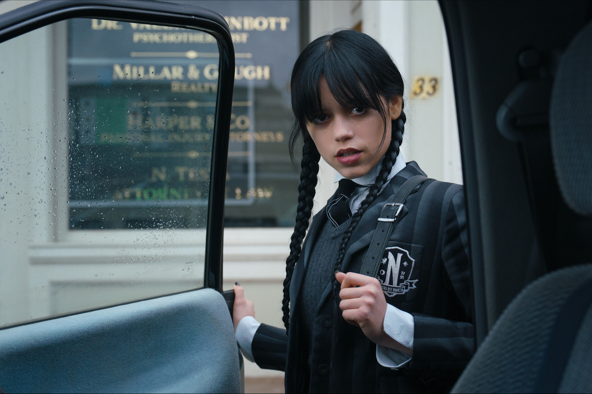 Jenna Ortega as Wednesday Addams opening a car door in ‘Wednesday’ Season 1.