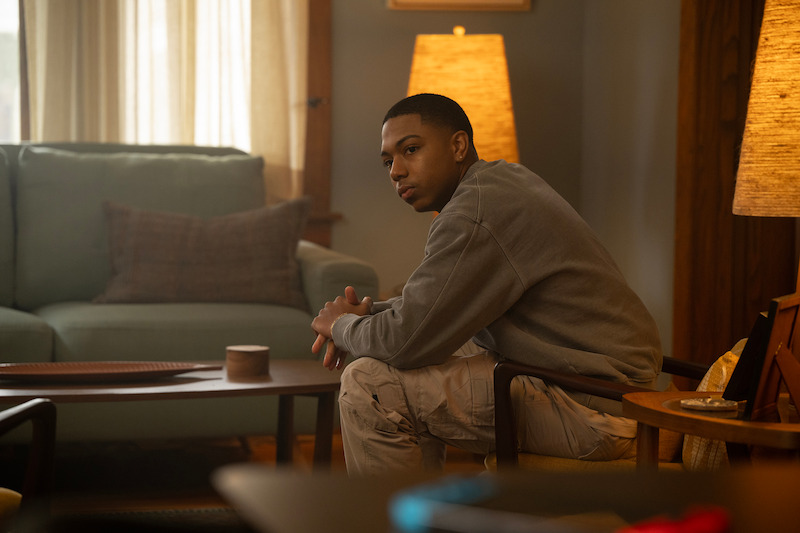 Thaddeus J. Mixson as Demetrius sits in a living room in Season 1 of ‘The Madness.’