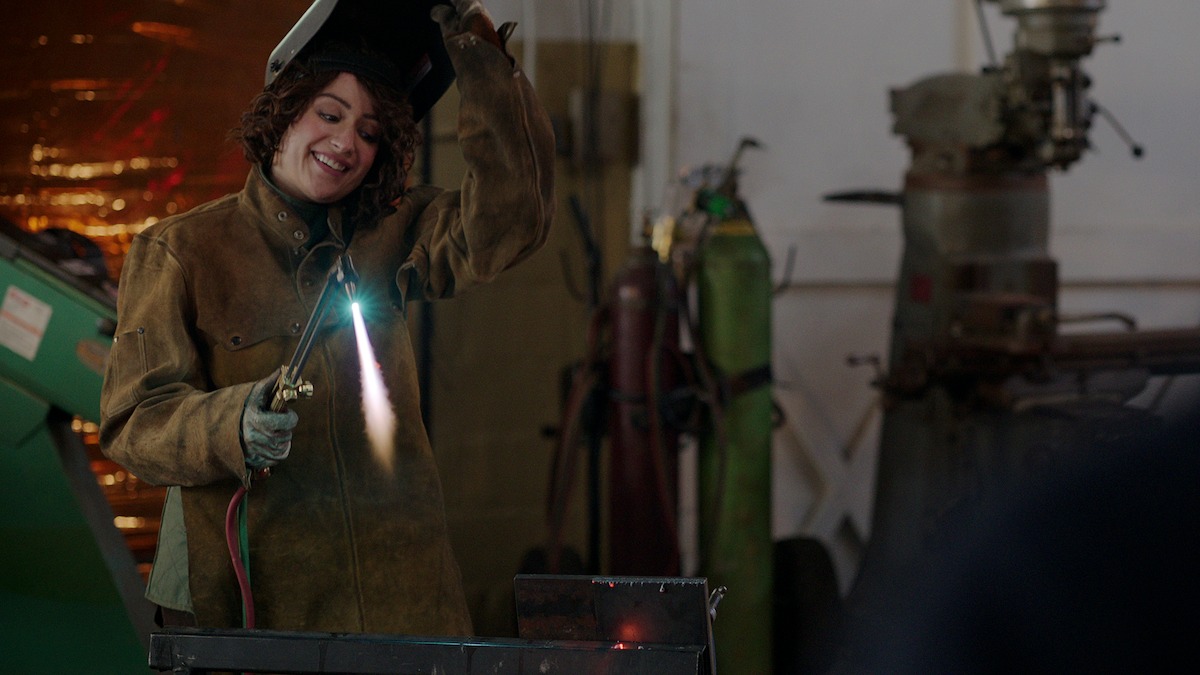 A person holding a welding torch