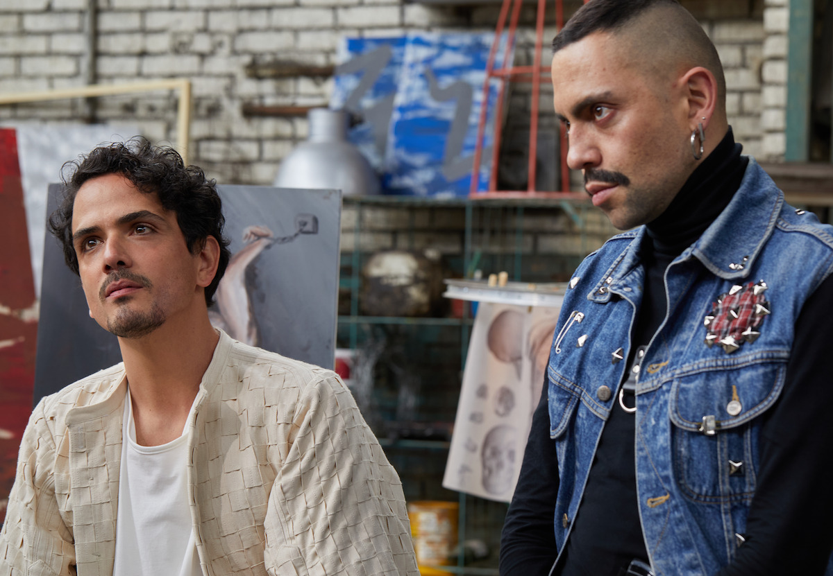 Two men, standing side by side