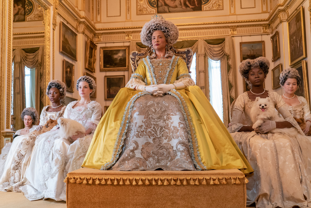 Queen Charlotte (Golda Rosheuvel) on her throne looking hella regal.