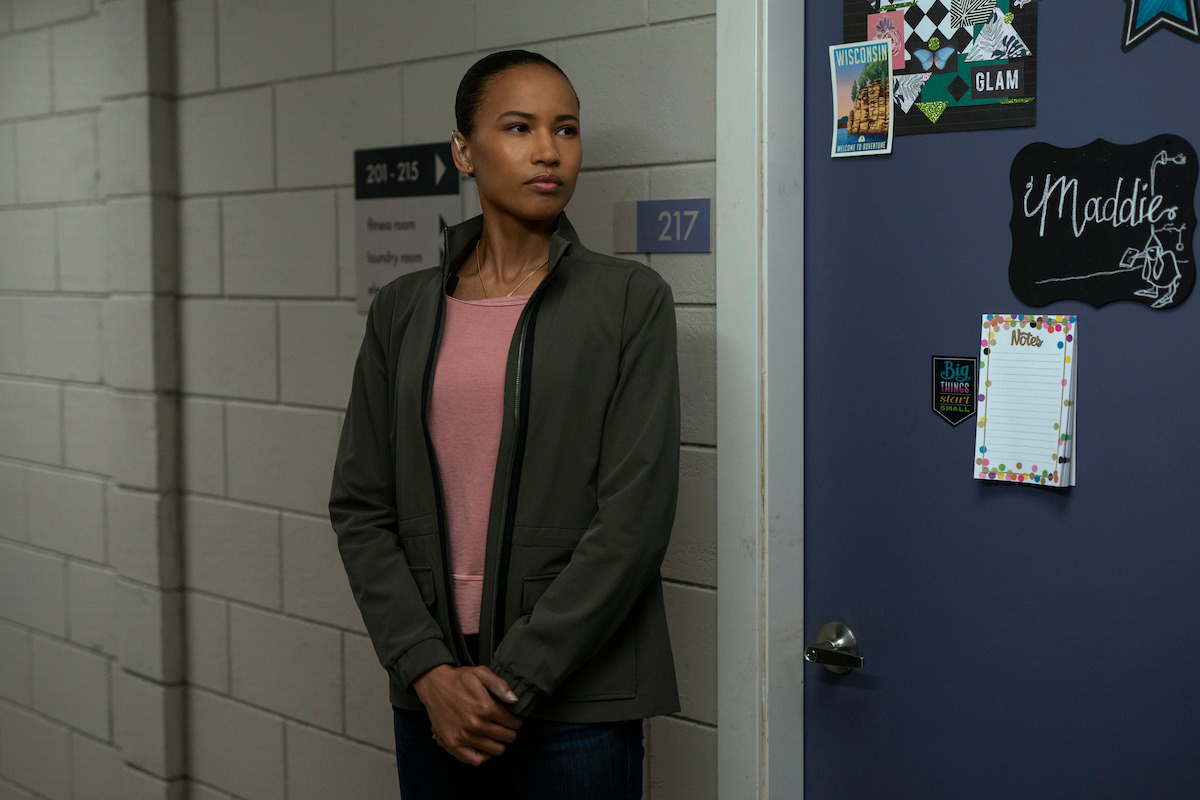 Secret Service agent Chelsea Arrington (Fola Evans-Akingbola) stands guard outside the dorm of the vice president’s daughter in 'The Night Agent.’