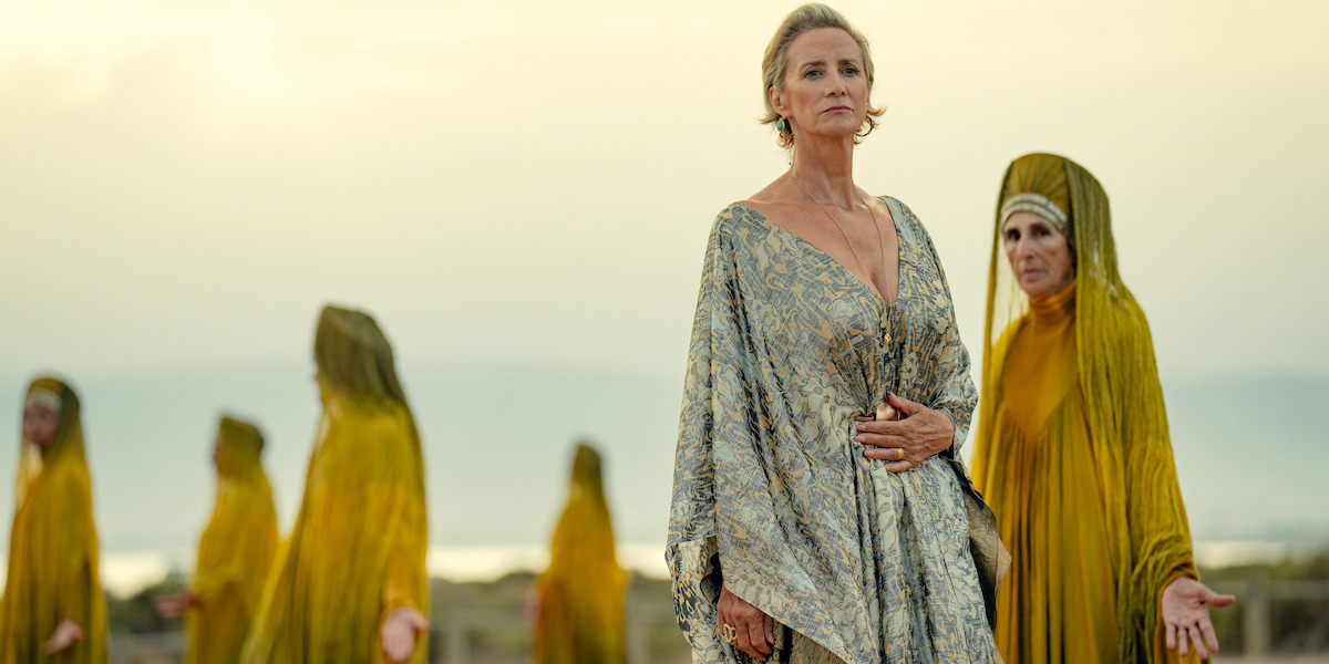 Janet McTeer as Hera walks with women in golden robes in Season 1 of ‘Kaos’