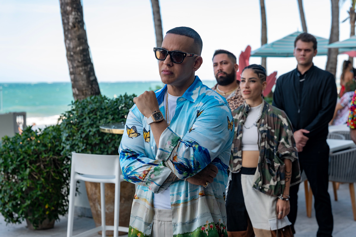 Daddy Yankee stands at a beach club in Season 1 of ‘Neon.’
