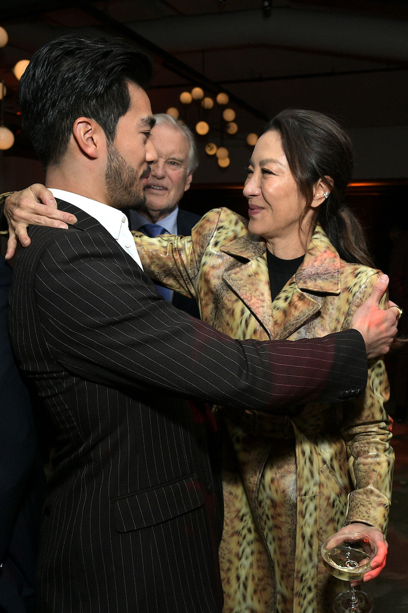 Justin Chien and Michelle Yeoh embrace for a hug at Netflix's 'The Brothers Sun' Los Angeles Premiere 