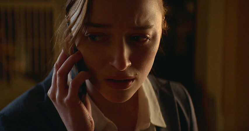 Phoebe Dynevor as Emily in 'Fair Play' on the phone looking distressed.