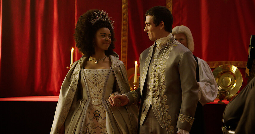 India Amarteifio and Corey Mylchreest as Young Queen Charlotte and Young King George.
