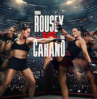 Two female mixed martial artists face off in a fighting ring inside a packed stadium, wearing athletic gear and gloves, with dramatic lighting and a large audience in the background.