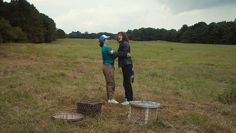 Eddie and Dustin holding each other in 'Stranger Things' Season 4.