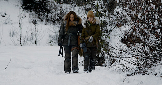 Jennifer Lopez and Lucy Paez walking in snow
