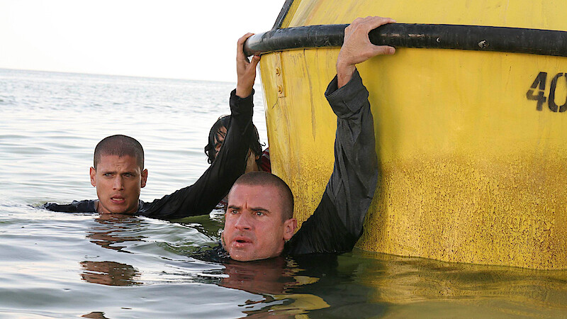 Wentworth Miller as Michael Scofield and Dominic Purcell as Lincoln 'Linc' Burrows hang on to a buoy.