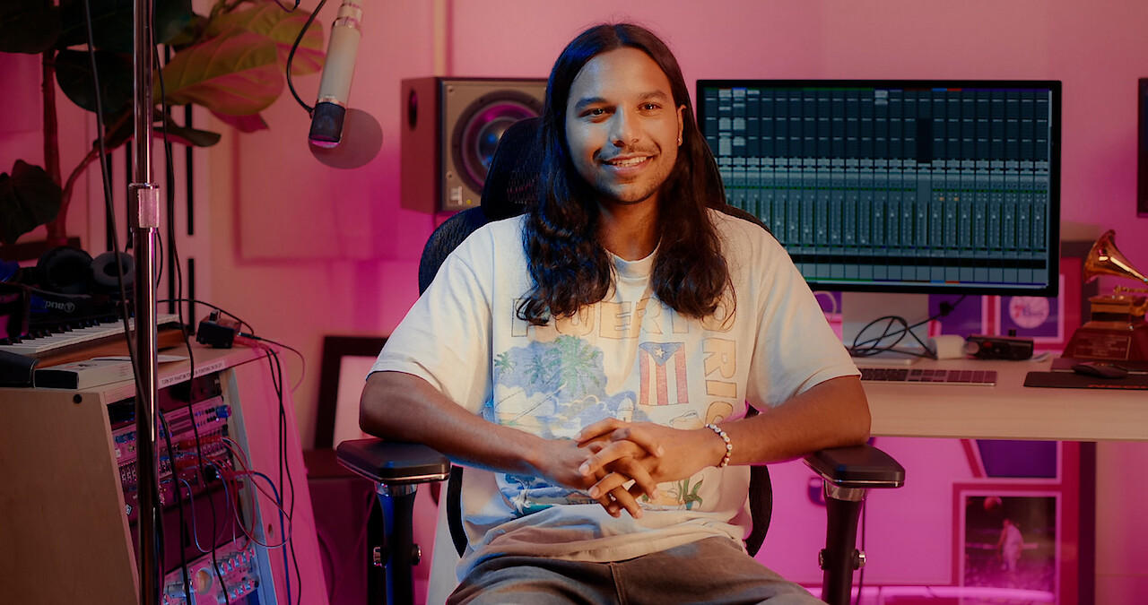 Tyler Dean Flores sits in a recording studio discussing the music in Season 1 of 'Neon.'