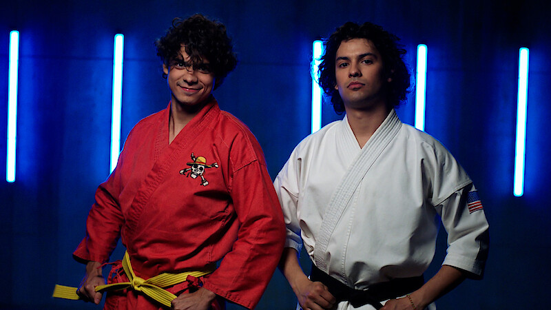 Inaki Godoy and Xolo Maridueña pose together in karate uniforms 