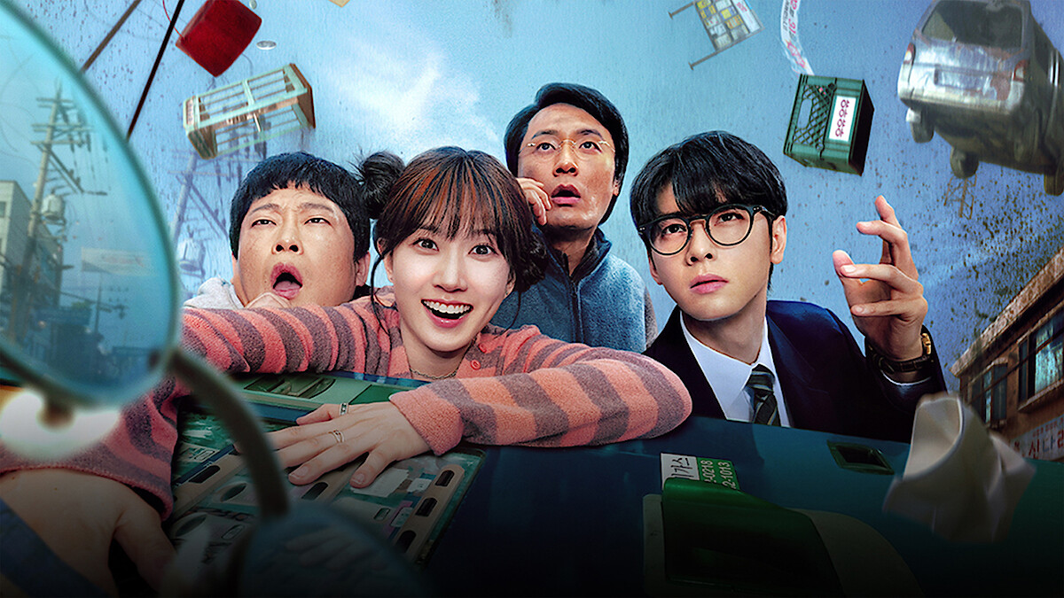 Four people with surprised expressions inside a tilting bus, floating debris and buildings in a chaotic city scene, suggesting an intense or supernatural event.