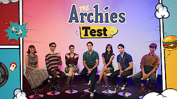 The cast of 'The Archies' seated on a stage together