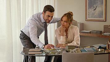 Jennifer Lopez as Jackie Cruz and Brett Goldstein as Daniel Blanchflower in 'Office Romance'