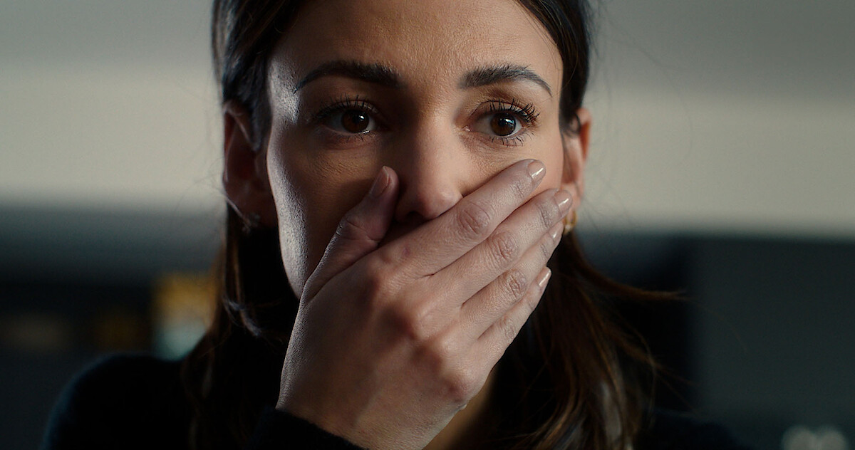 Michelle Keegan as Maya Stern hold her hand over her mouth with a shocked expression in the series 'Fool Me Once'