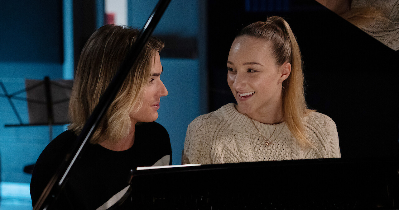 Jodi and Stig sitting at a piano