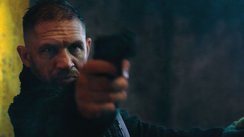 Tom Hardy holds a gun in 'HAVOC'
