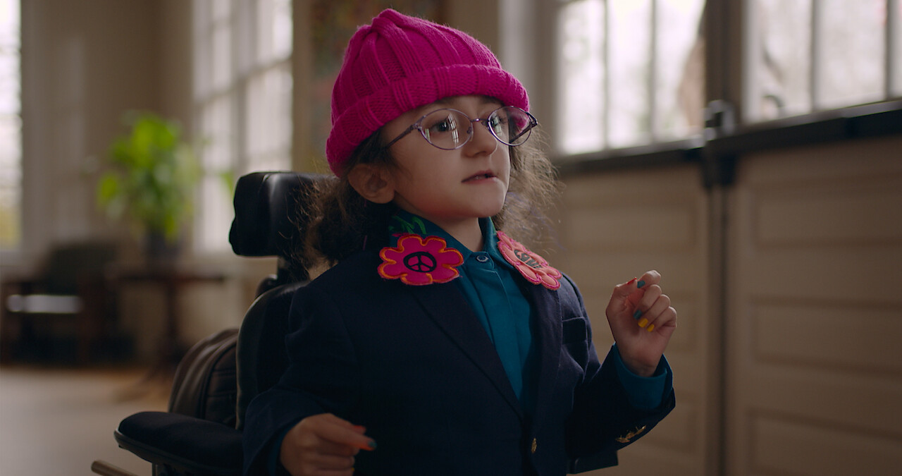 Esperanza in a pink hat