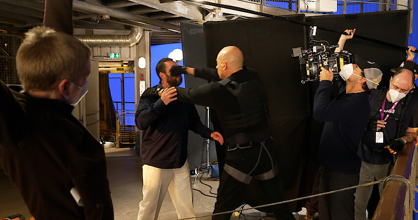 Mark Strong and Adam Sandler filming a stunt for Murder Mystery 2.