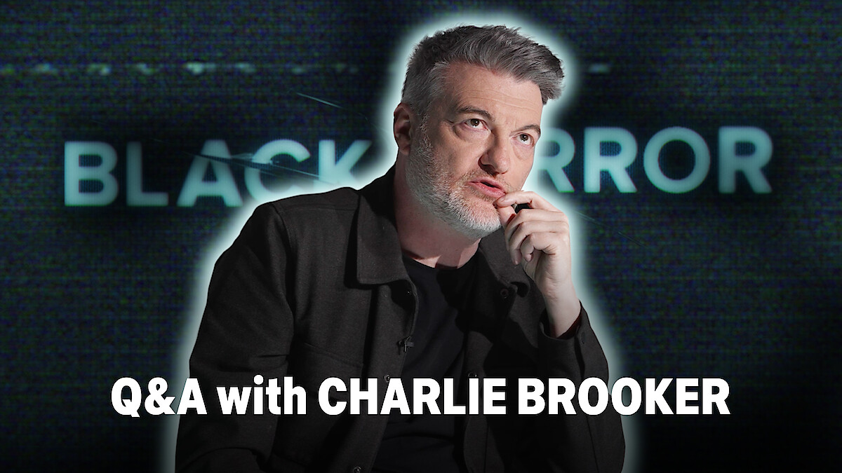 Charlie Brooker, with a thoughtful expression, is seated against a blurred background featuring the words 'BLACK MIRROR.' The text 'Q&A with CHARLIE BROOKER' is prominently displayed at the bottom.