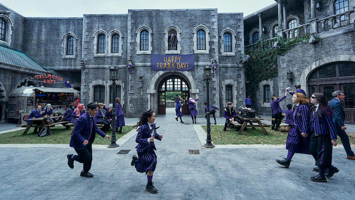 Students in the Nevermore Academy courtyard in ‘Wednesday’ Season 2.