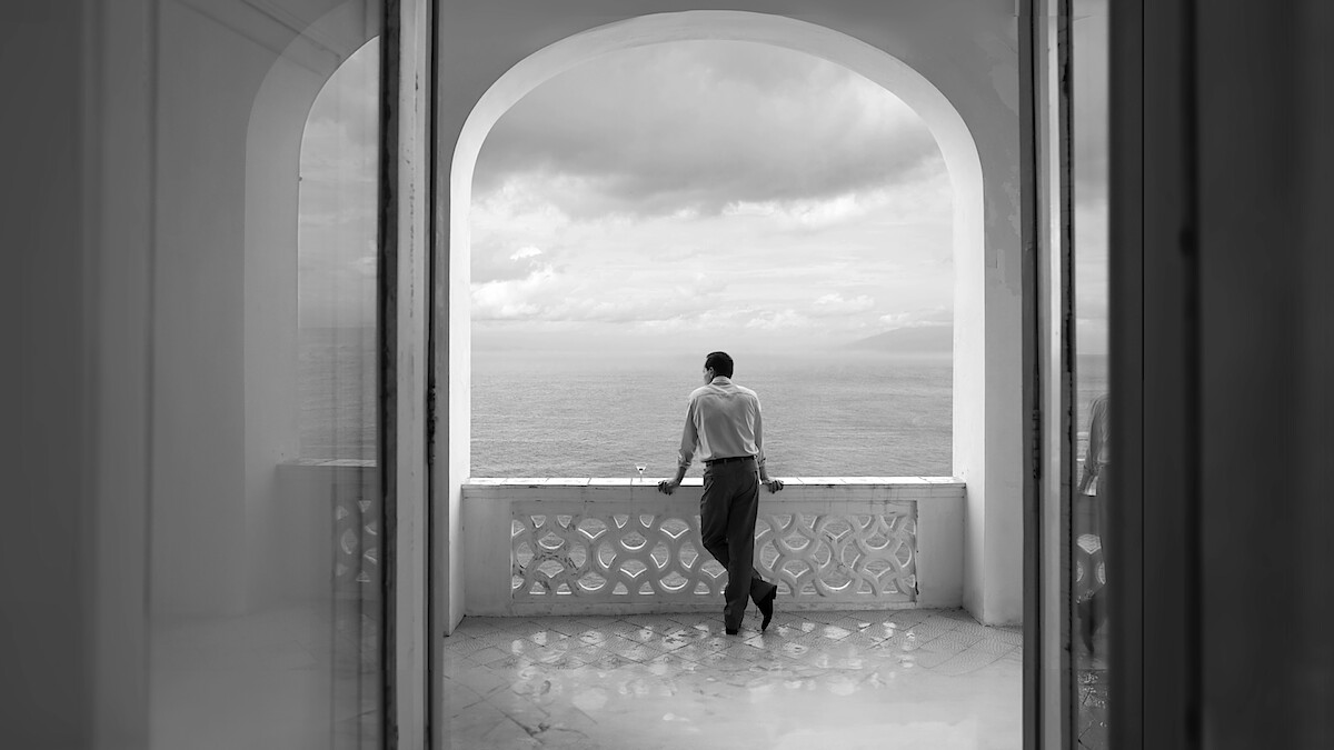 Tom Ripley stares out at the sea