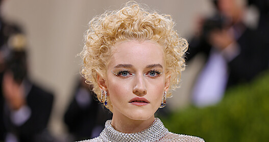A glamour close up photo of actress Julia Garner