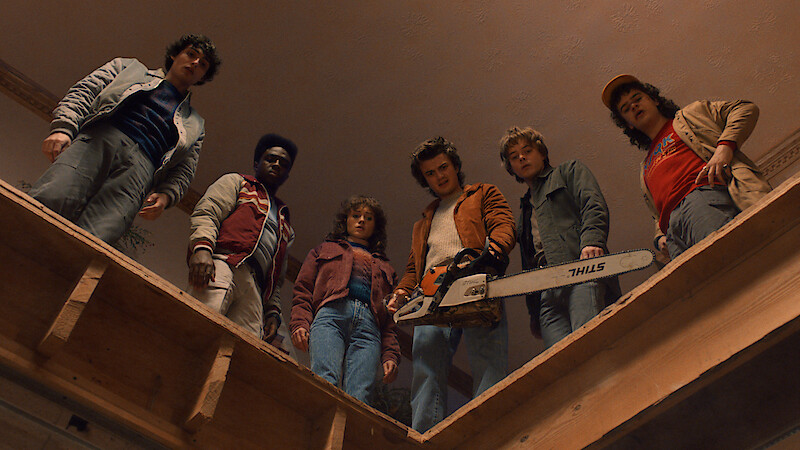 Finn Wolfhard as Mike Wheeler, Caleb McLaughlin as Lucas Sinclair, Natalia Dyer as Nancy Wheeler, Joe Keery as Steve Harrington, Charlie Heaton as Jonathan Byers, and Gaten Matarazzo as Dustin Henderson in 'Stranger Things' Season 5