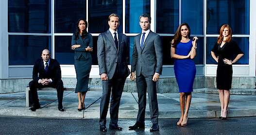 Rick Hoffman as Louis Litt, Gina Torres as Jessica Pearson, Gabriel Macht as Harvey Specter, Patrick J. Adams as Mike Ross, Meghan Markle as Rachel Zane, Sarah Rafferty as Donna Paulsen in Suits.