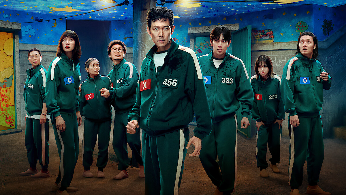 'Squid Game' Season 3 players in green tracksuits with numbers.