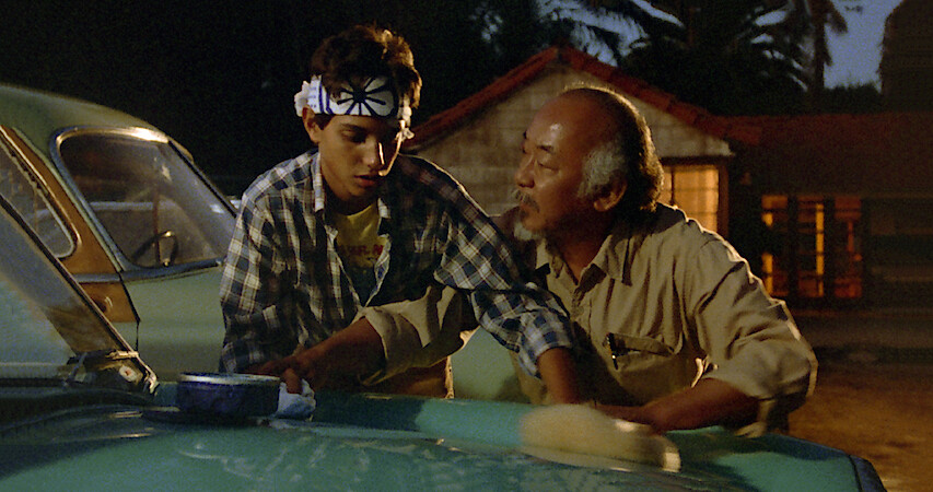 An image of young Daniel LaRusso with Mr. Miyagi