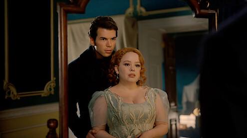 Nicola Coughlan as Penelope Featherington wears a yellow gown at a ball in Season 3 of 'Bridgerton'