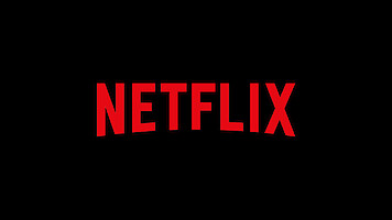 Red Netflix logo in all capital letters centered on a plain black background.