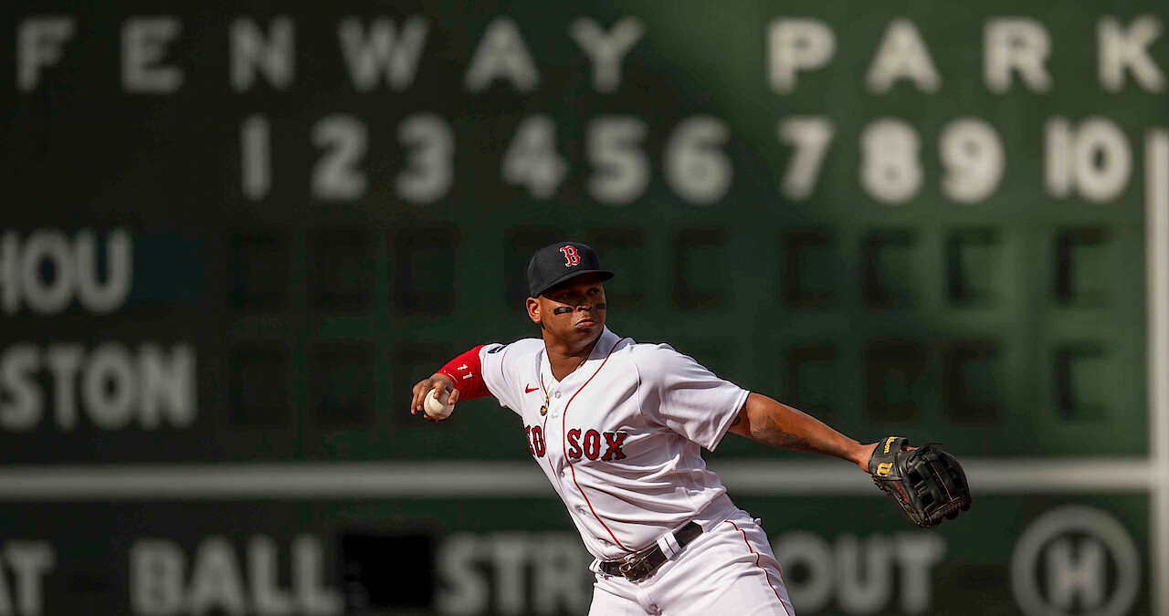 Rafael Devers of the Boston Red Sox throws during the first inning of a game against the Houston Astros at Fenway Park in Boston.
